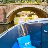 Cruise like a local in an open boat in Amsterdam