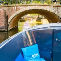 Cruise like a local in an open boat in Amsterdam