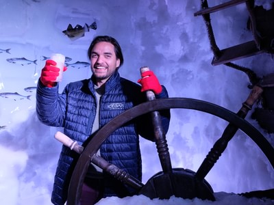 Amsterdam icebar man posing behind the steering wheel 1000x750