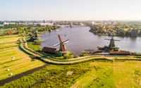 Watch windmills at Zaanse Schans and visit the countryside.