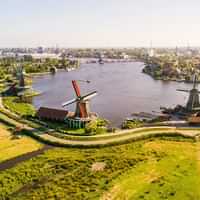 Watch windmills at Zaanse Schans and visit the countryside.