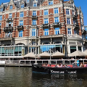 Cruise like a local in an open boat in Amsterdam