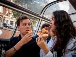 Is this the right time for an Amsterdam canal cruise with New York Pizza?
